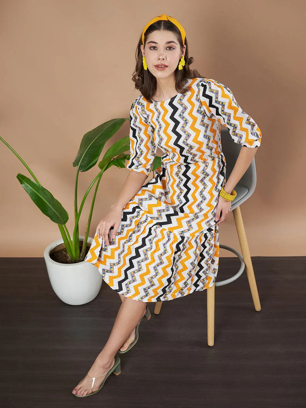 Mustard Zigzag Stripes Puff Sleeve Printed Fit & Flare Midi Dress with Round Neck, Short Sleeves, Gathered Details, and Flared Hemline